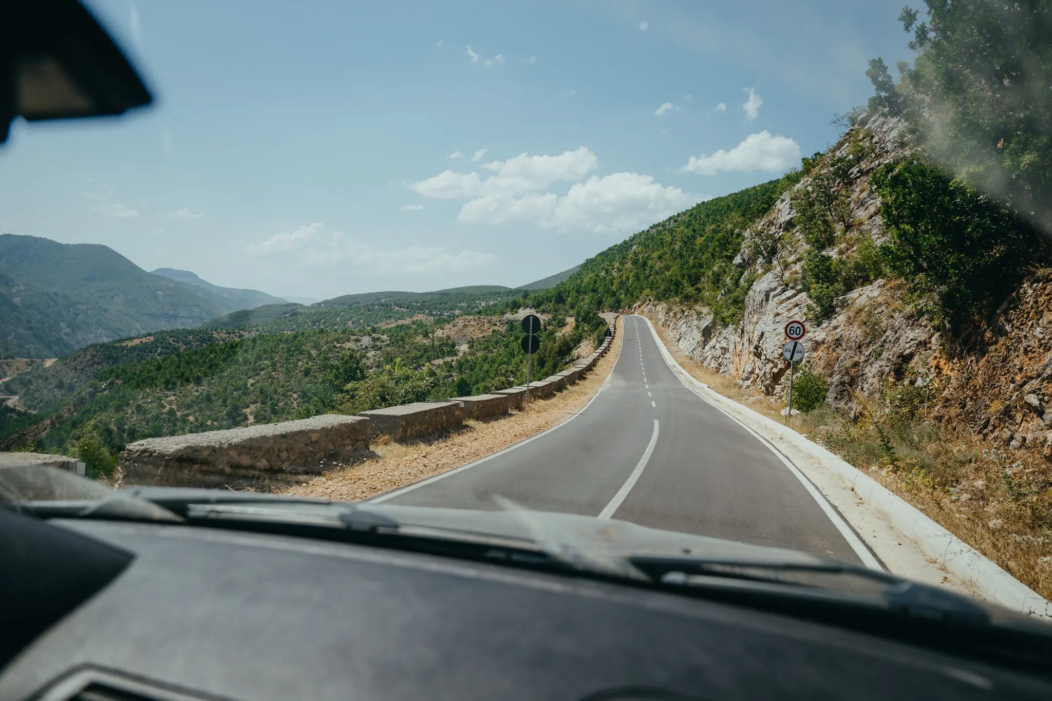 winding mountain road in Albania from car perspective
